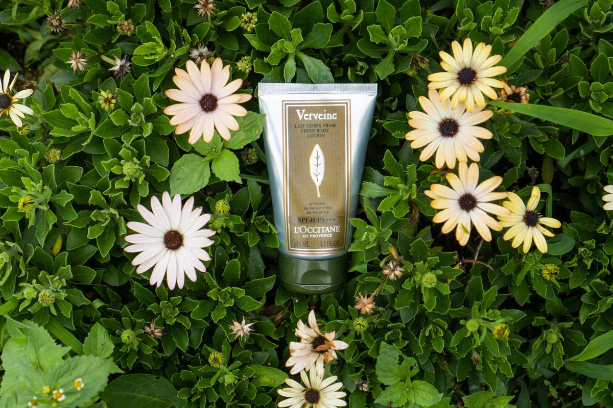 Bottle of fresh herbal aftershave next to shaved jawline showing calm, non-irritated skin